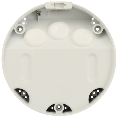 Zdjęcie przedstawia okrągłą, białą podstawę montażową do kamer, wykonaną z tworzywa sztucznego. Widoczne są otwory montażowe oraz miejsca na przewody, co ułatwia instalację urządzenia.