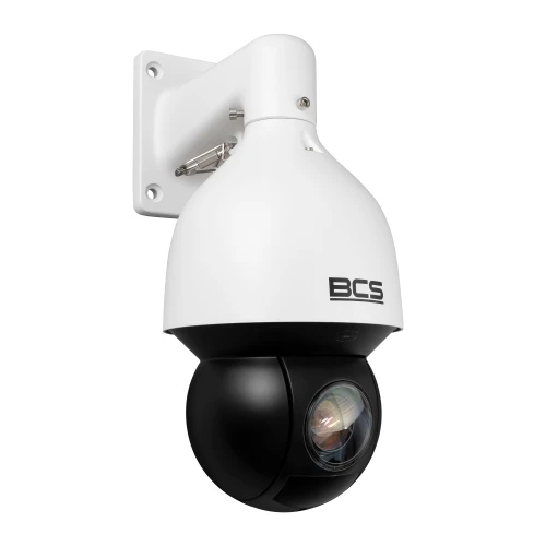 Biała, obrotowa kamera monitoringu BCS zamontowana na ścianie, z czarną kopułą obiektywu. Kamera ma nowoczesny design i jest przeznaczona do zewnętrznego monitoringu.
