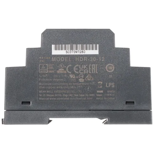 Zdjęcie przedstawia szary zasilacz montowany na szynie DIN z widocznymi oznaczeniami modelu HDR-30-12 oraz certyfikatami. Na górze znajduje się kod kreskowy i numer seryjny SC73M7280.